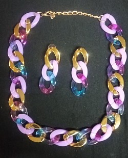 Colorful chain necklace with earrings to match to dress up any outfit.